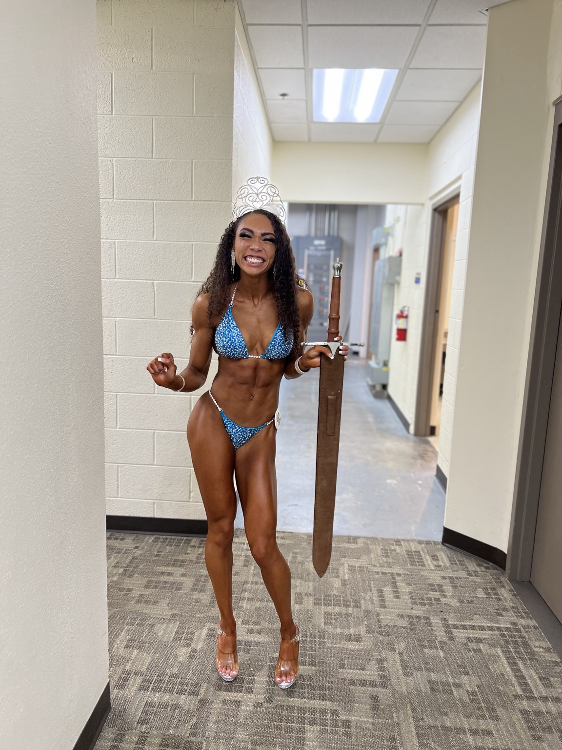 Gully Girl Collective founder Jas celebrating after a bodybuilding competition